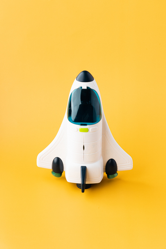 Space Ship Model on Yellow Background